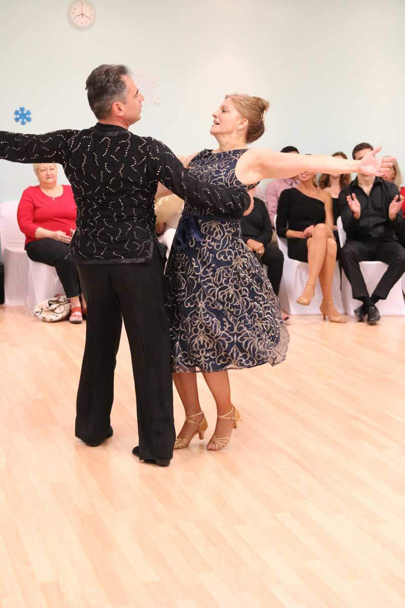 Ivan dancing with a student at Dance Passion